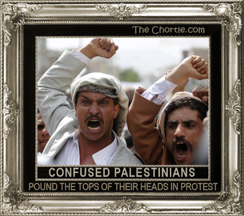 Confused Palastinians pound the tops of their heads in protest